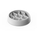 Gray ceramic bowl with wavy design on a white background