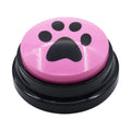Pink button with a black paw print design on a white background
