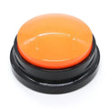 Orange button with black base on a white background