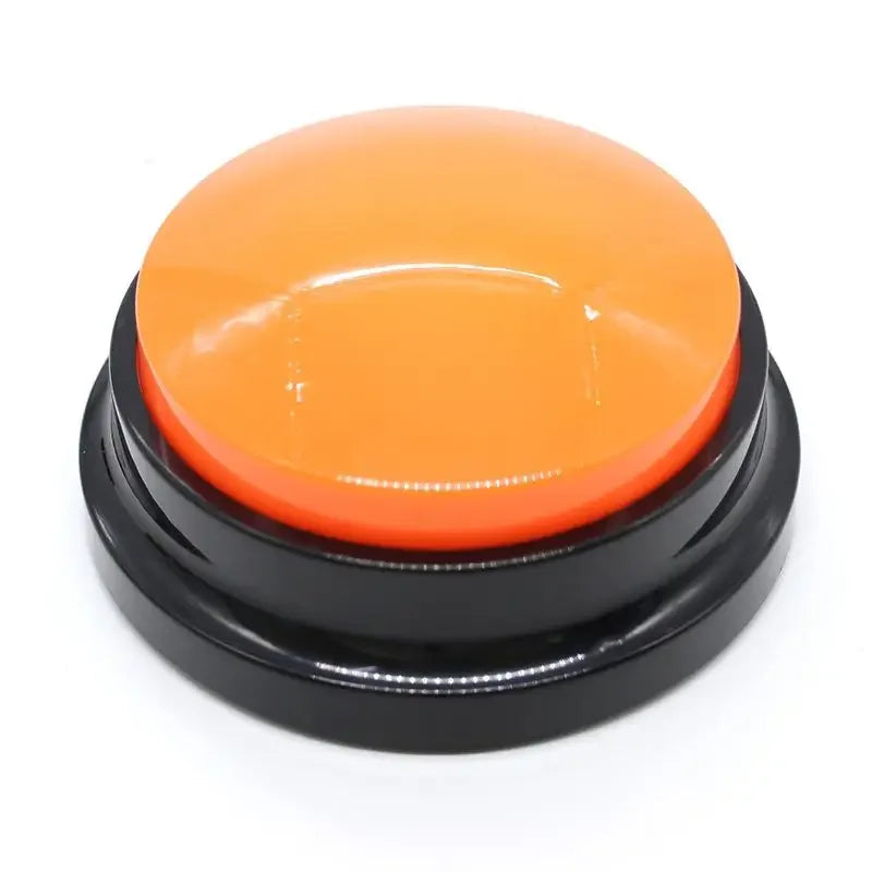 Orange button with black base on a white background