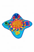 Colorful dog puzzle toy on a yellow surface with a puppy sitting next to it. from shop ThinkyPets