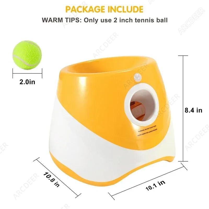 Yellow and white ball launcher with dimensions and tennis ball included on a white background