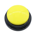 Yellow button with black base on a white background