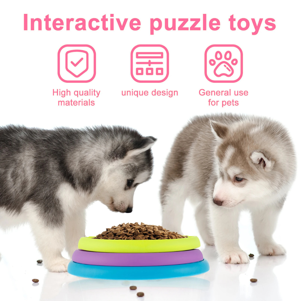 Two puppies interacting with a colorful puzzle toy on a white background supplied by ThinkyPets