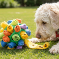 Dog playing with a colorful hedgehog-shaped toy on grass sold by thinkyPets