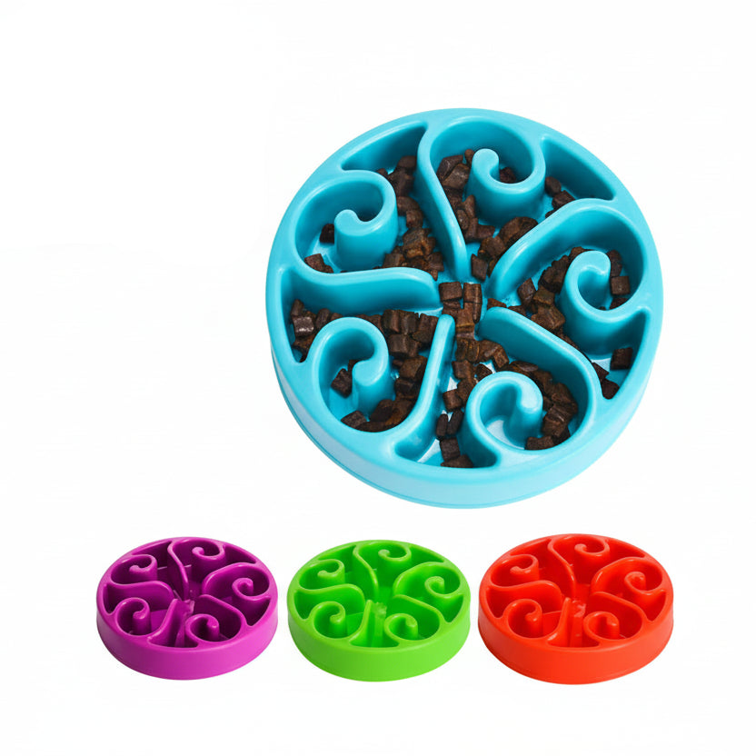 Dog eating from a blue slow feeder bowl on a wooden floor sold by thinkpets nz