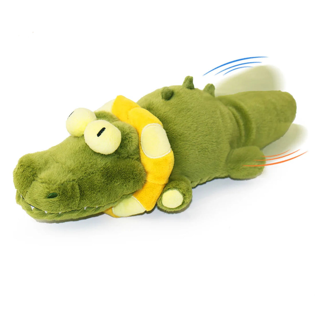 Dog playing with a green alligator toy on a white background