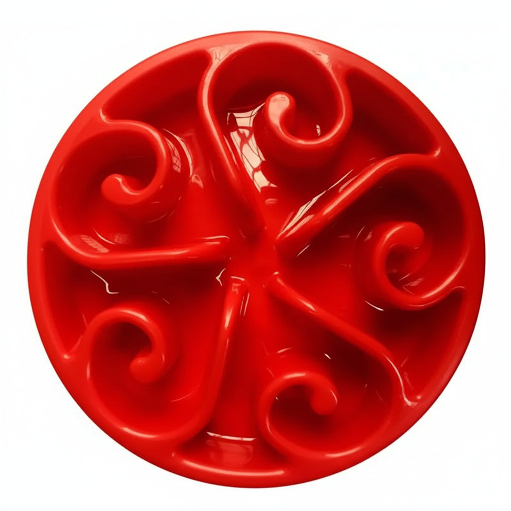 Red decorative plate with intricate designs on a white background
