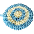 Blue and white ruffled flower headband on a light gray background