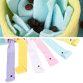 Pastel-colored fleece fabric with small brown buttons and a close-up of a fleece ball.