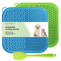 Blue and green licking mats for dogs and cats with a spatula on a white background