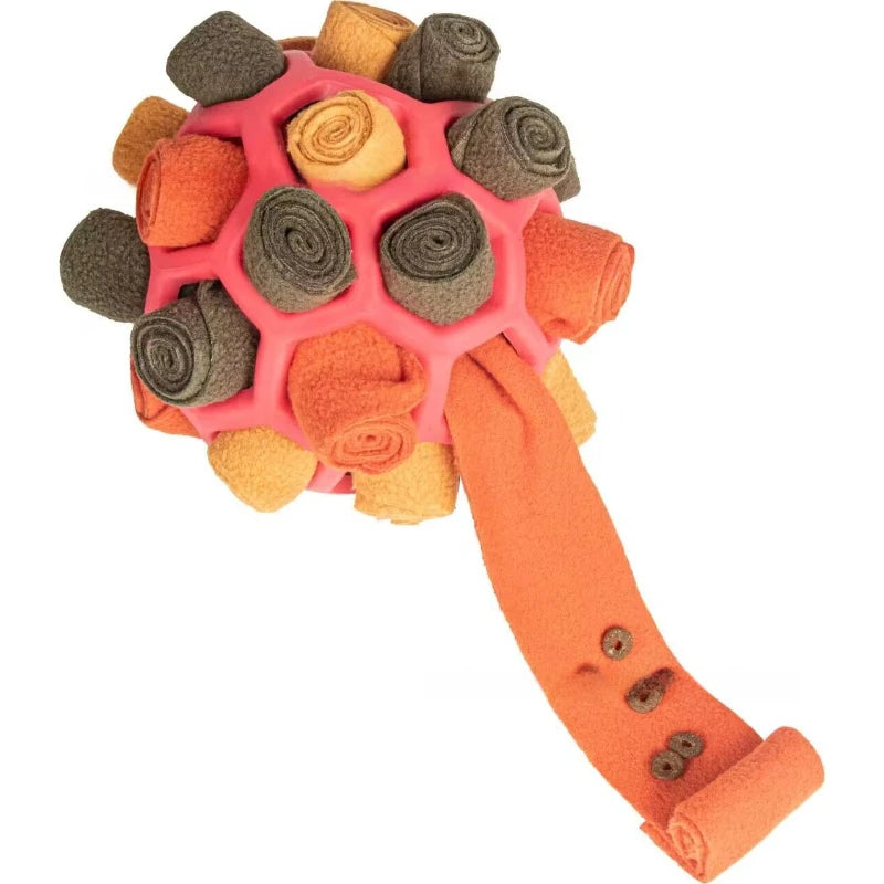 Dog toy with pink center, orange handle, and textured surface on a white background  on the shop ThinkyPets