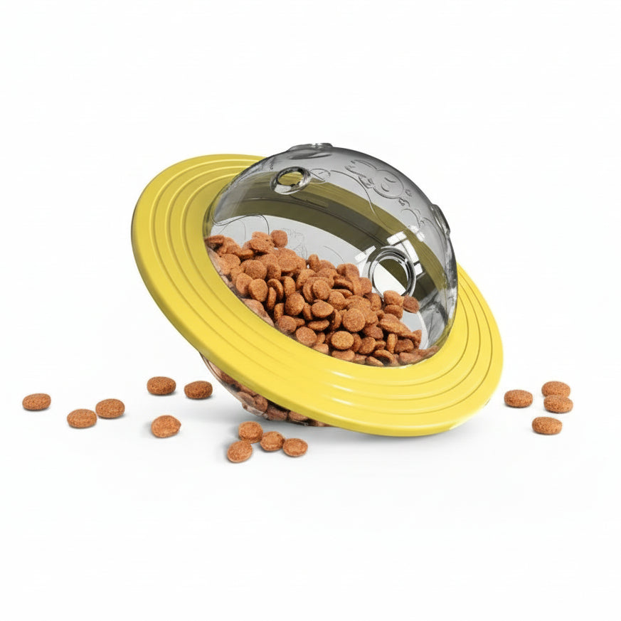 Yellow and clear dog food bowl with a dog in the background