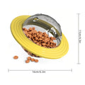 Yellow pet food puzzle with transparent top, filled with kibble, on a white background with measurements.