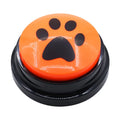Orange button with a black paw print design on a white background